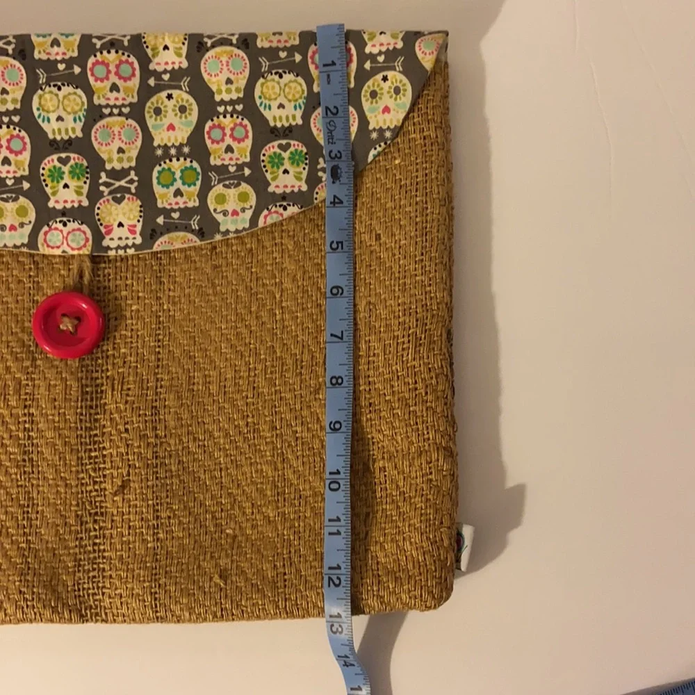 It’s a wrap burlap bag with sugar skulls, laptop bag, accessory bag